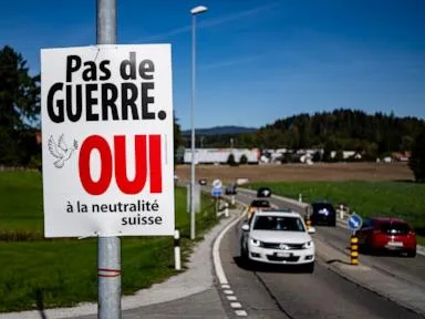 Voters in Switzerland decide on right-wing party's proposal to tighten neutrality rules
